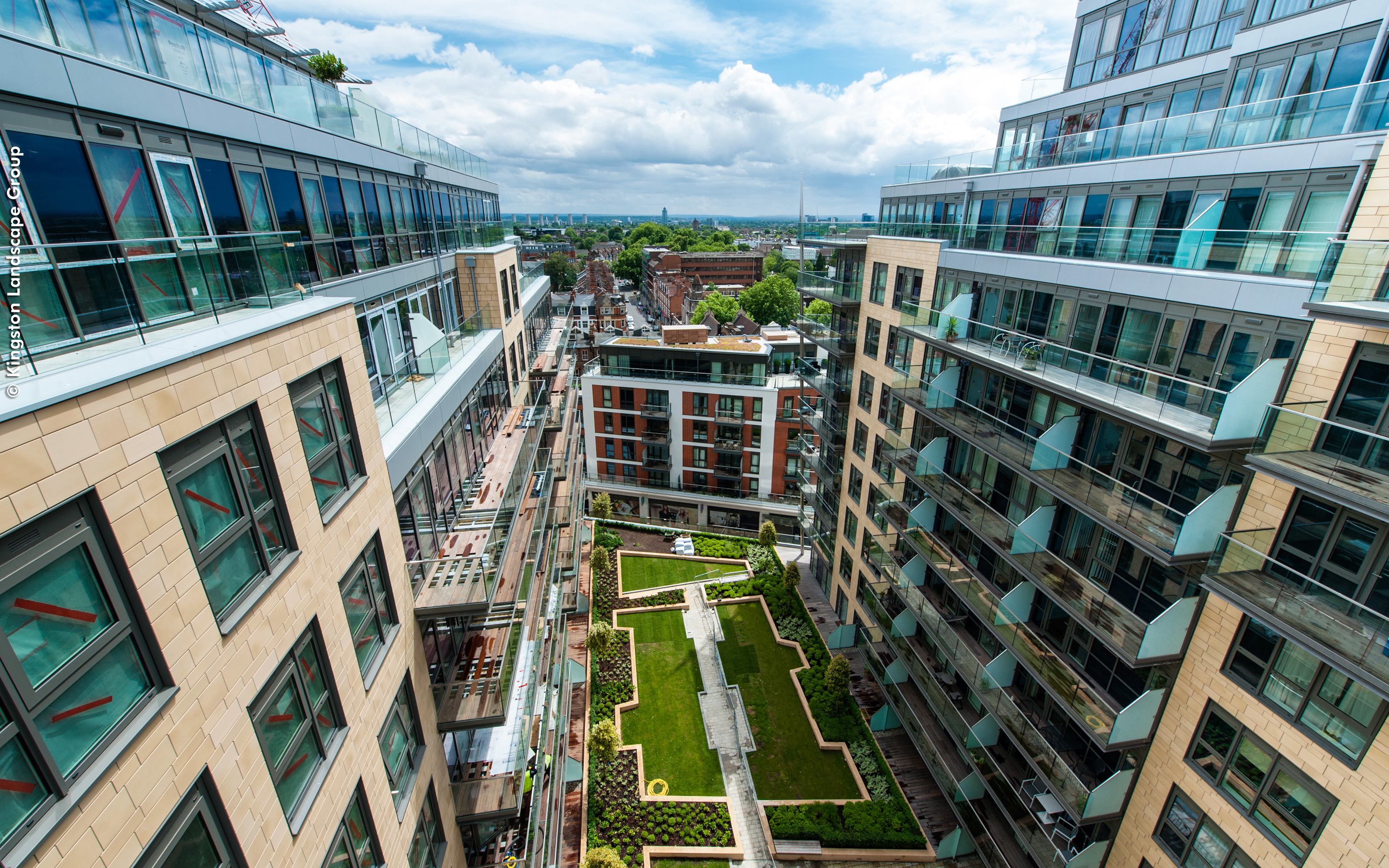 View from above onto the courtyard surrounded by high-rise buildings